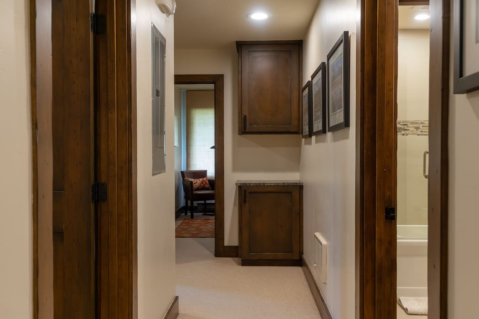 Hallway between the master and two guest rooms. Linen Closet.