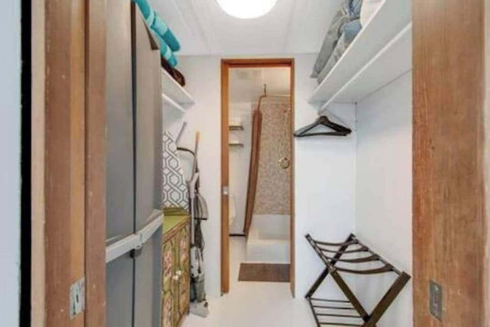 A closet room filled with cabinets and shelves.