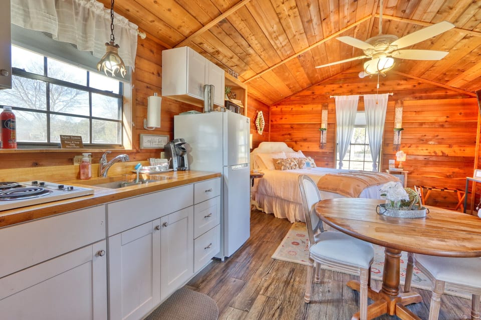 Kitchenette with stove, sink, coffee maker, and refrigerator