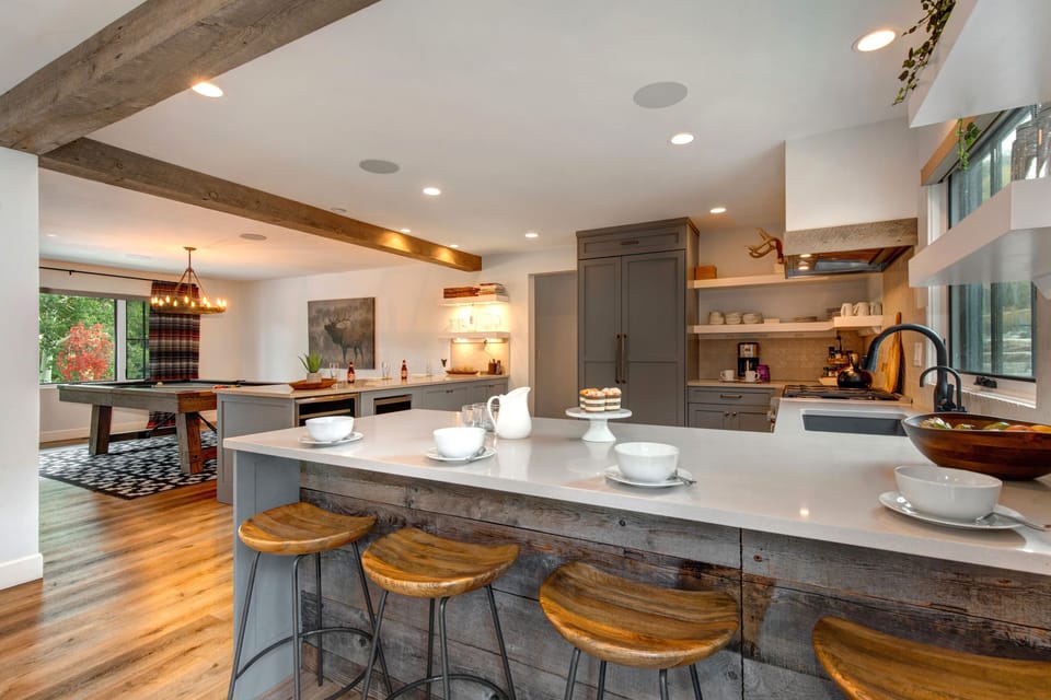 Gourmet Kitchen with Stone Counters and Bar Seating for Four