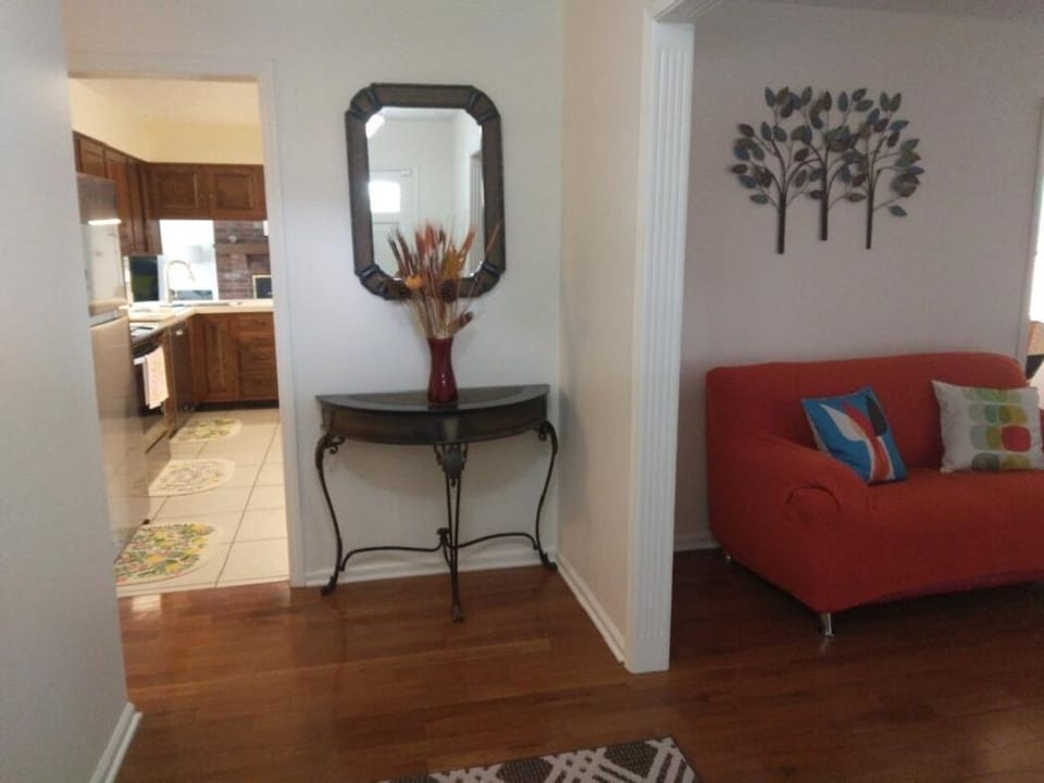 Entering view of the kitchen, foyer and living room