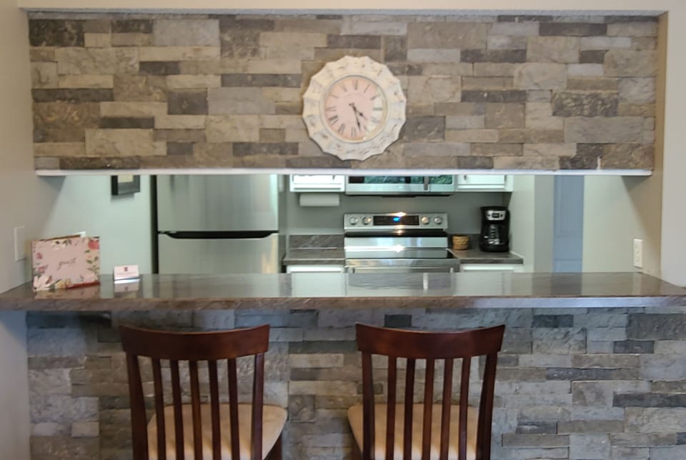Breakfast Bar with Kitchen in background