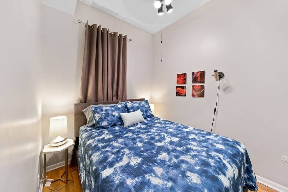 Primary Bedroom with queen sized bed and attached bathroom
