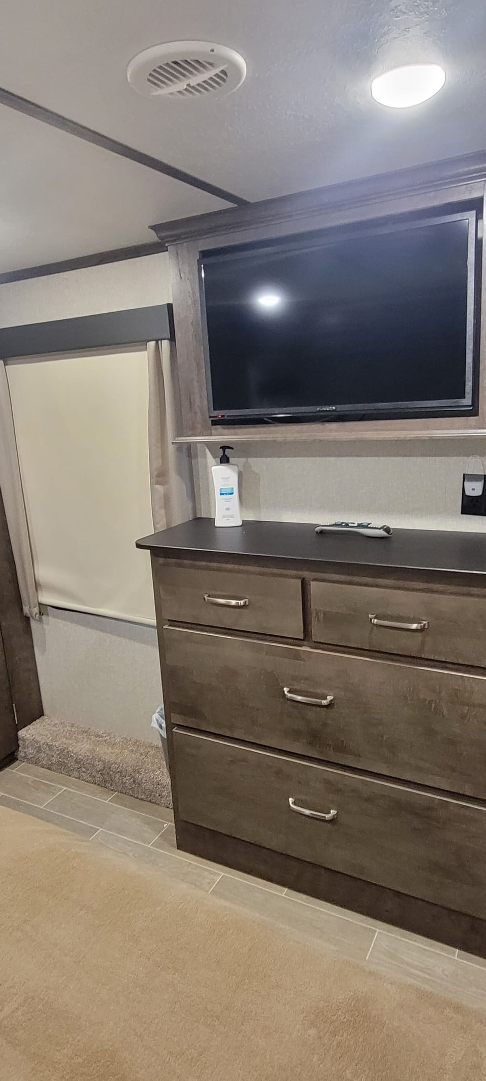 Dresser and tv in master.