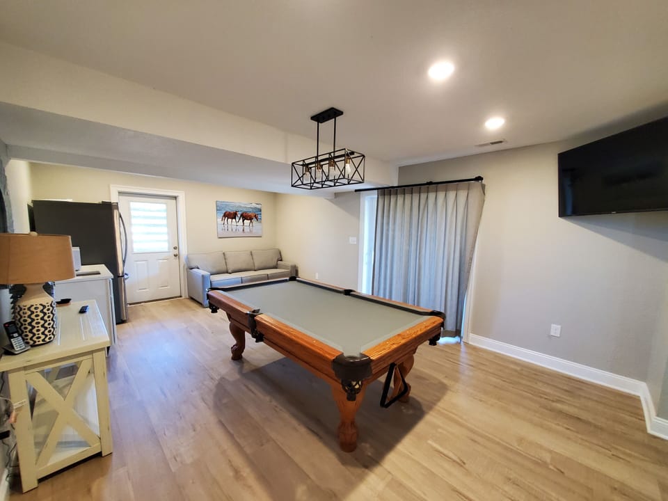 Pool Table in Recreation Room - Upon entry you'll enter a recreation room with a 55-inch LED TV and modern coastal design.
