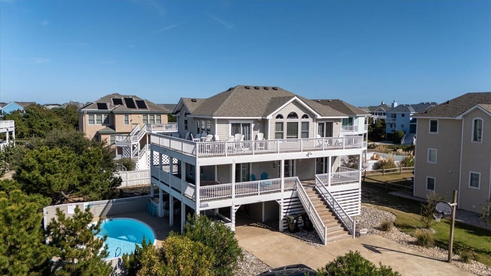 Aerial home and pool view - Your view of this immaculate exterior of home when arriving.