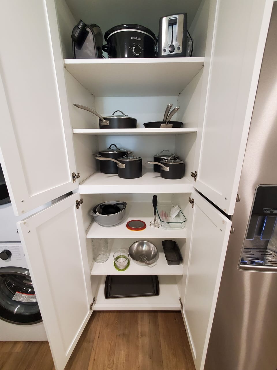 Waffle maker, crockpot, toaster, pots, pans, bowls and everything else you need.