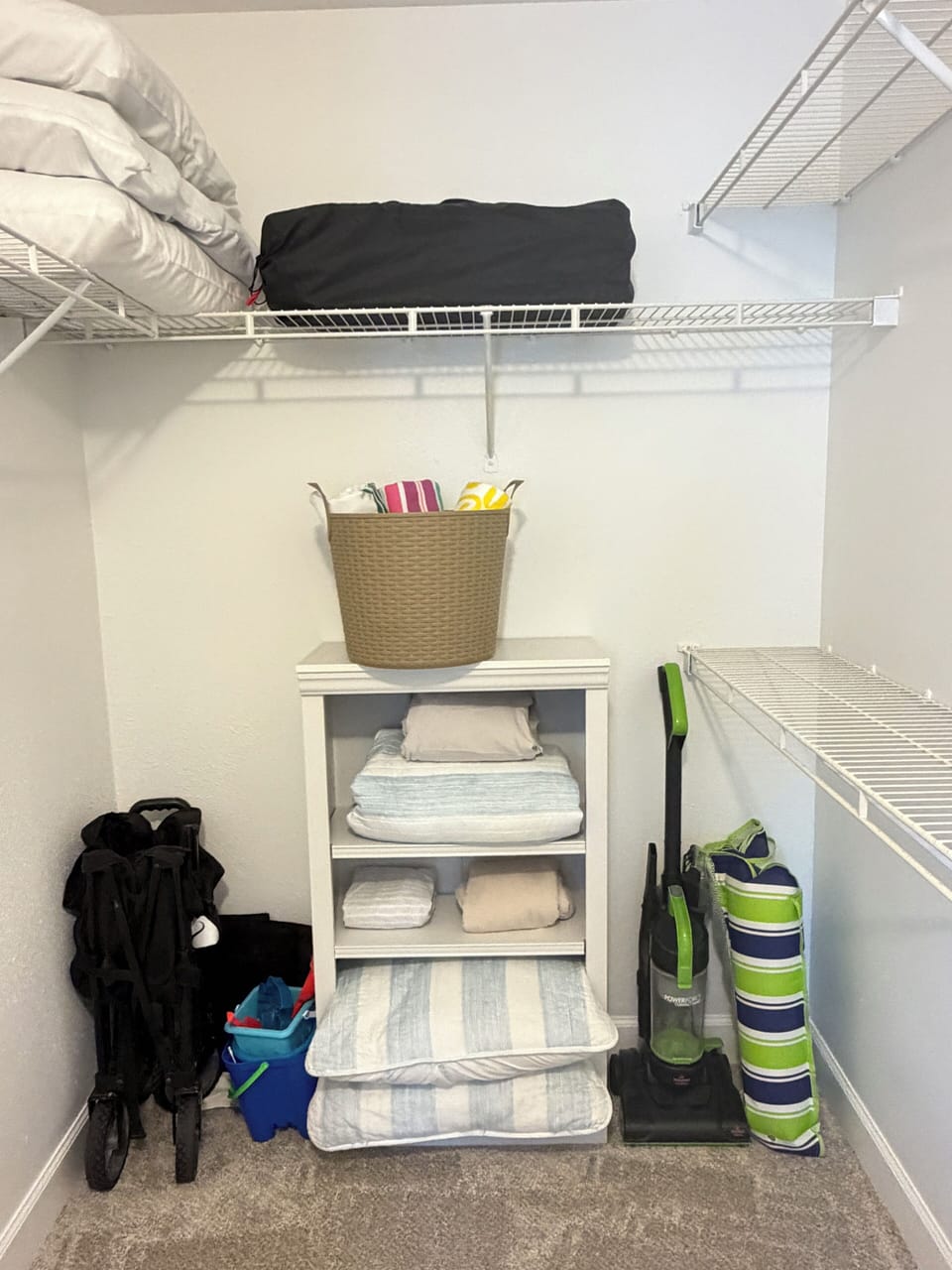 Large walking closet with lots of storage , travel cot , beach items