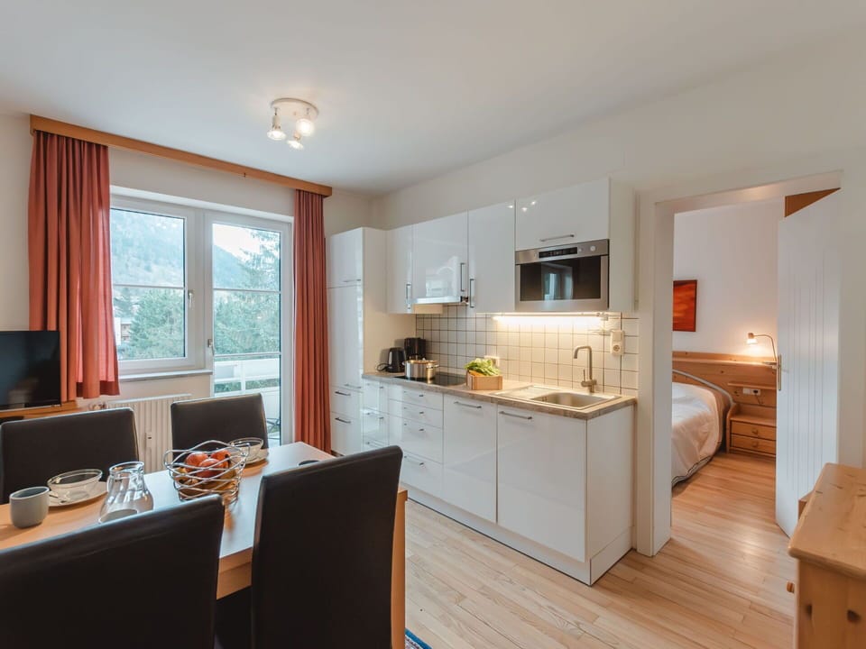 Cabinetry, Countertop, Furniture, Window, Kitchen, Wood, Curtain, Flooring, Floor, Table