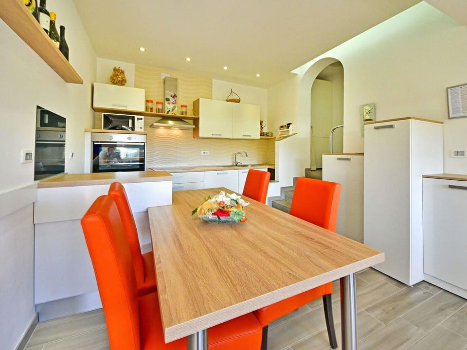 Furniture, Property, Table, Countertop, Cabinetry, Wood, Orange, Home Appliance, Kitchen, Interior Design