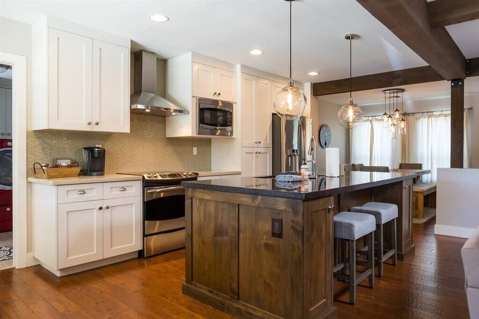 Fully stocked kitchen with stainless appliances and granite counters