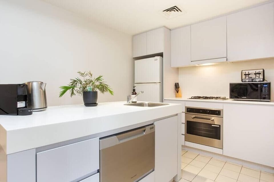 Open plan kitchen with full size fridge, oven and gas hob. Great kitchen Island for the budding chef and there are great take way options nearby to enjoy in the comfort of the property 