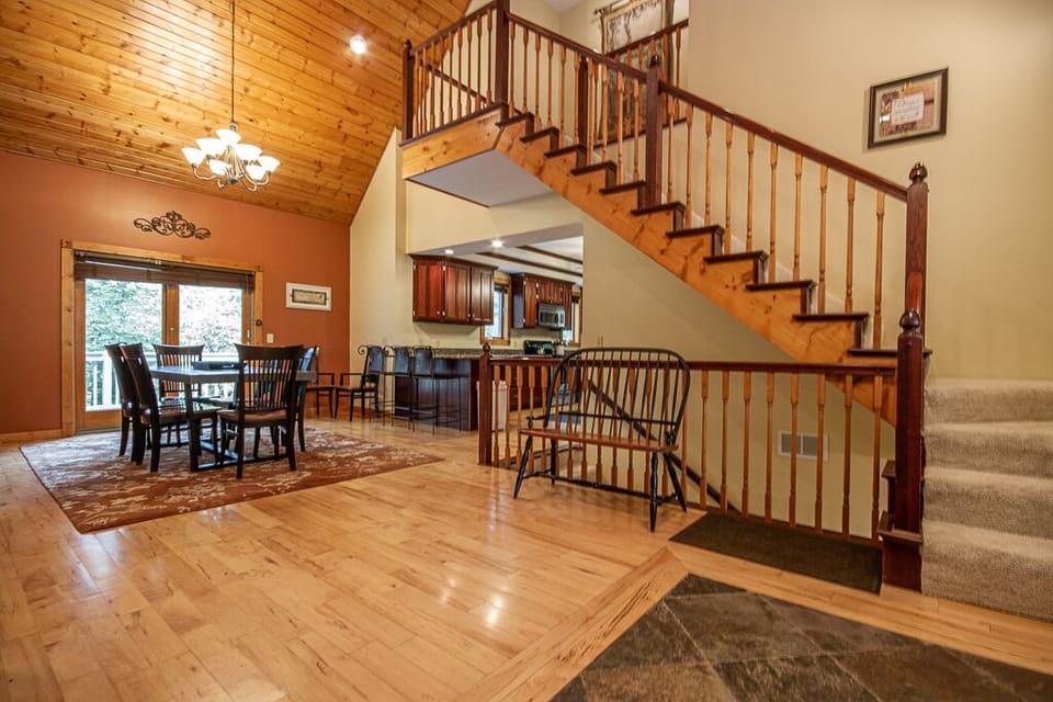 The grand staircase leads up to the large Primary suite