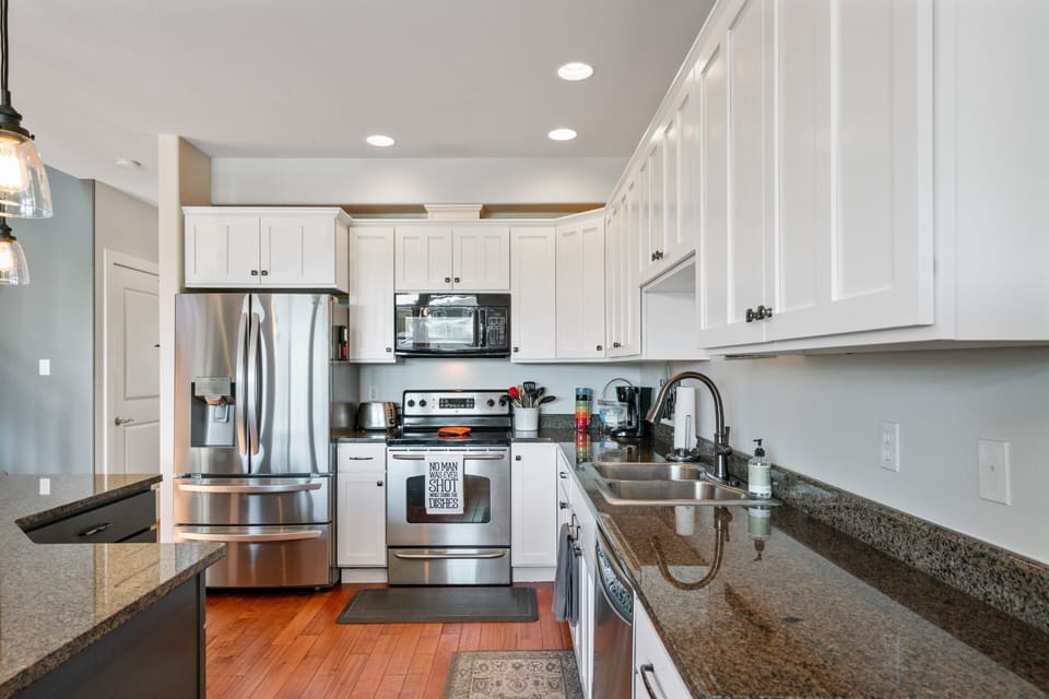 Above it All: - New fridge and plenty of counter space to make fantastic in-home meals.