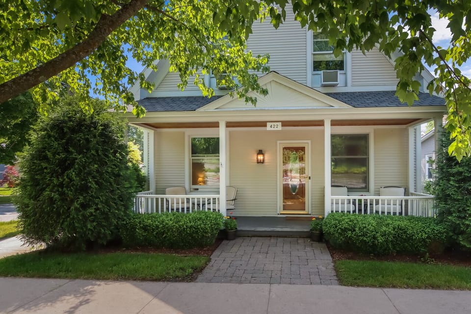 Charming front porch with chairs for coffee 