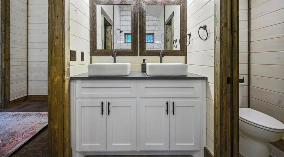 Experience the charm of our bathroom, where classic elegance and modern amenities meet to make every morning routine feel like a treat.