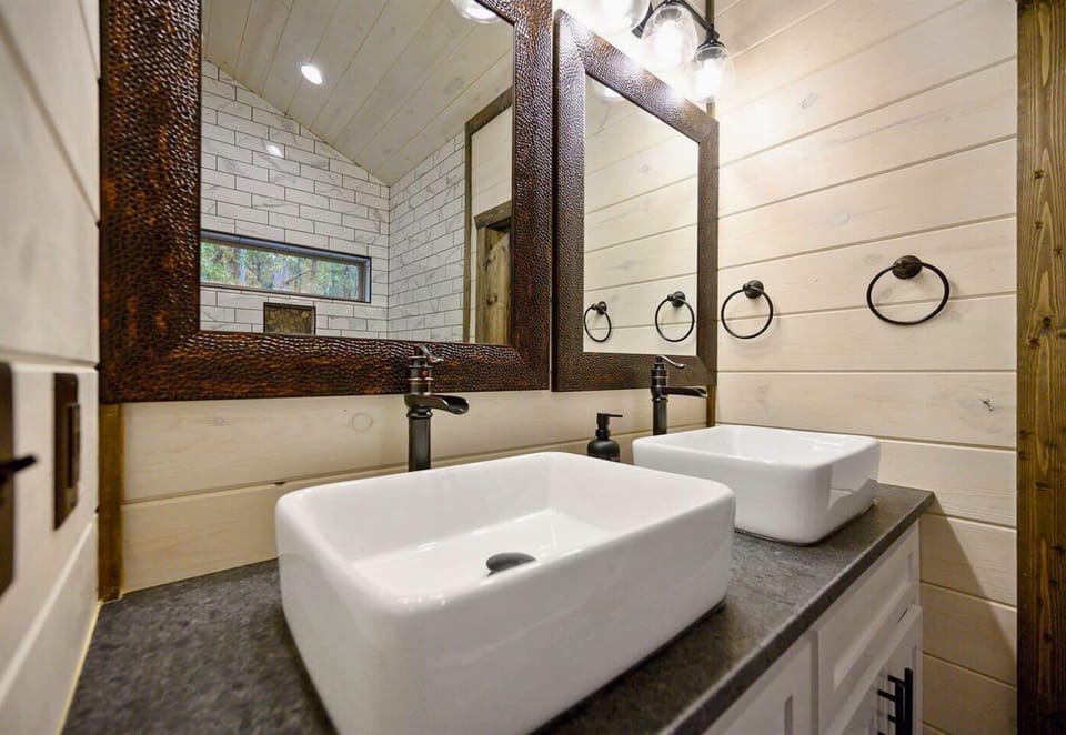 Let the warm, soothing ambiance of our bathroom envelop you, complete with plush towels and all the comforts of home.