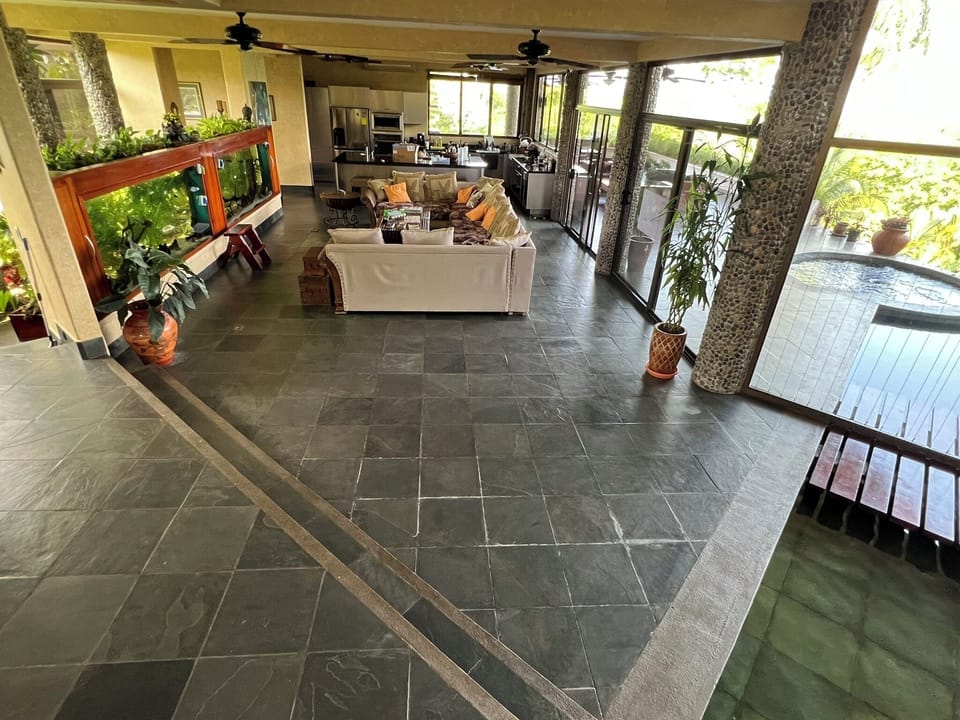 view towards seating area and kitchen from the stairs