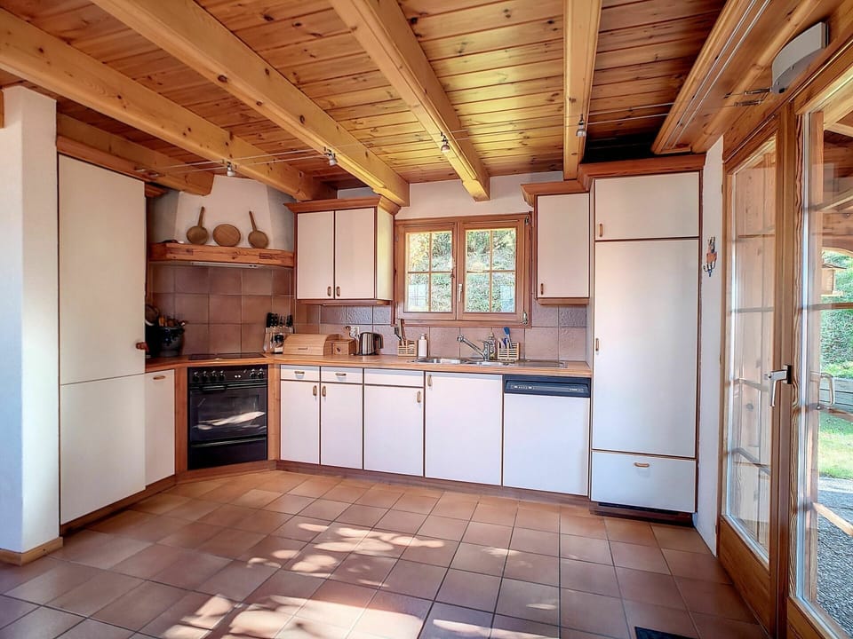Cabinetry, Countertop, Property, Building, Window, Furniture, Kitchen, Kitchen Appliance, Wood, Kitchen Stove