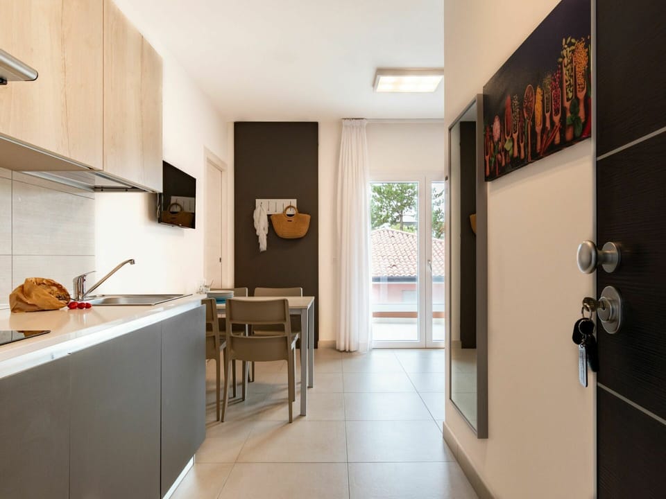 Property, Furniture, Cabinetry, Houseplant, Door, Wood, Plant, Lighting, Kitchen, Interior Design