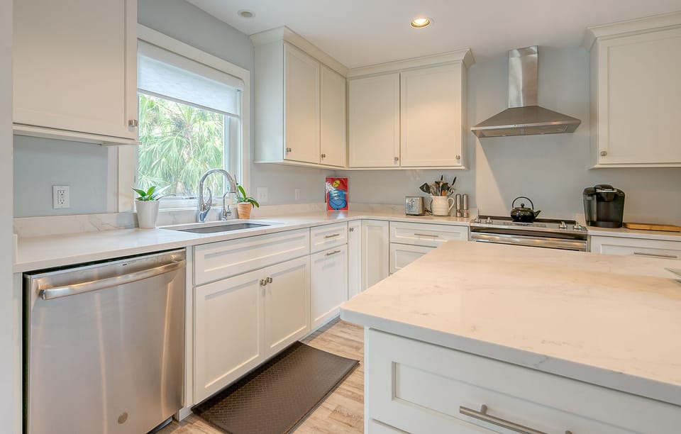 Spacious kitchen with stainless steel appliances.