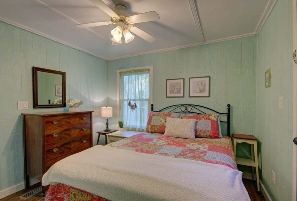 The second bedroom is cozy and elegant.