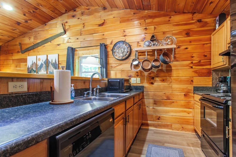 Main level kitchen at Edgeview Chalet in Bryson City with modern appliances and wood interiors.