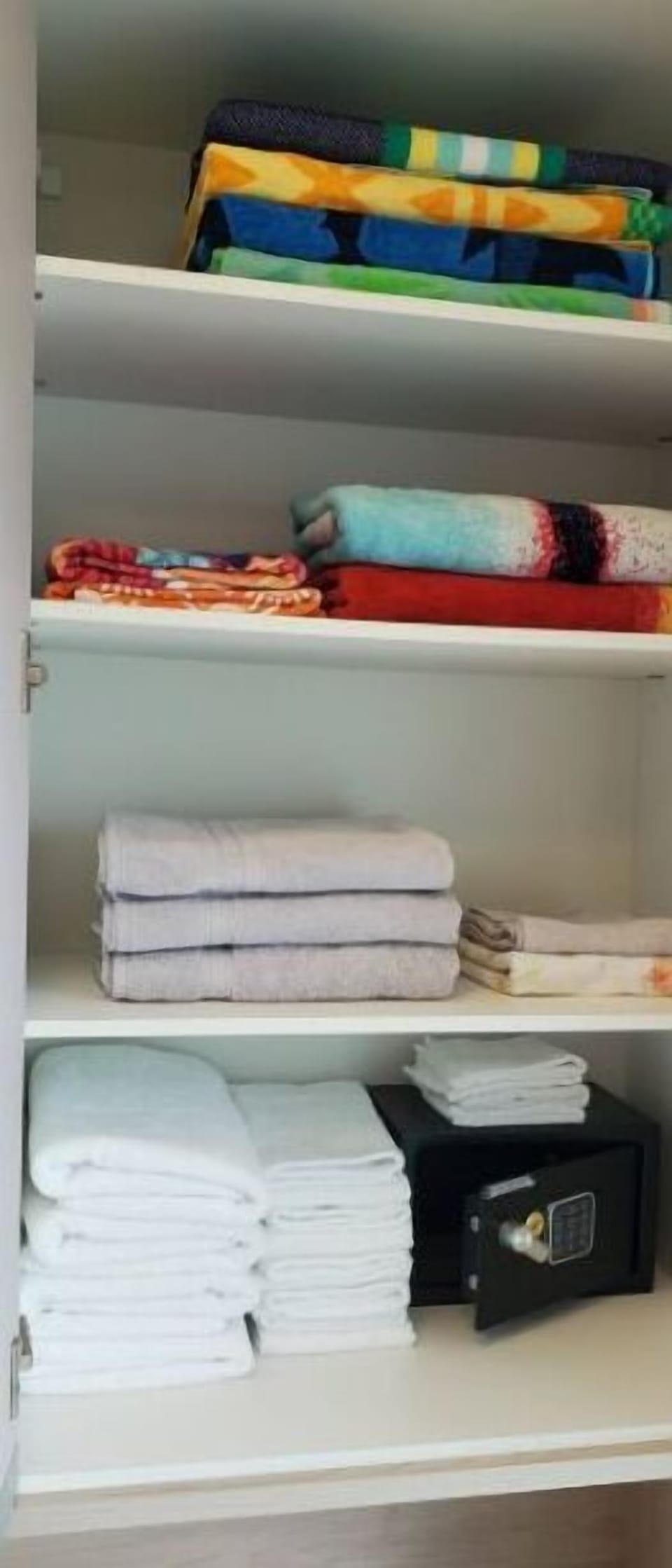 Towel cabinet with a personal safe