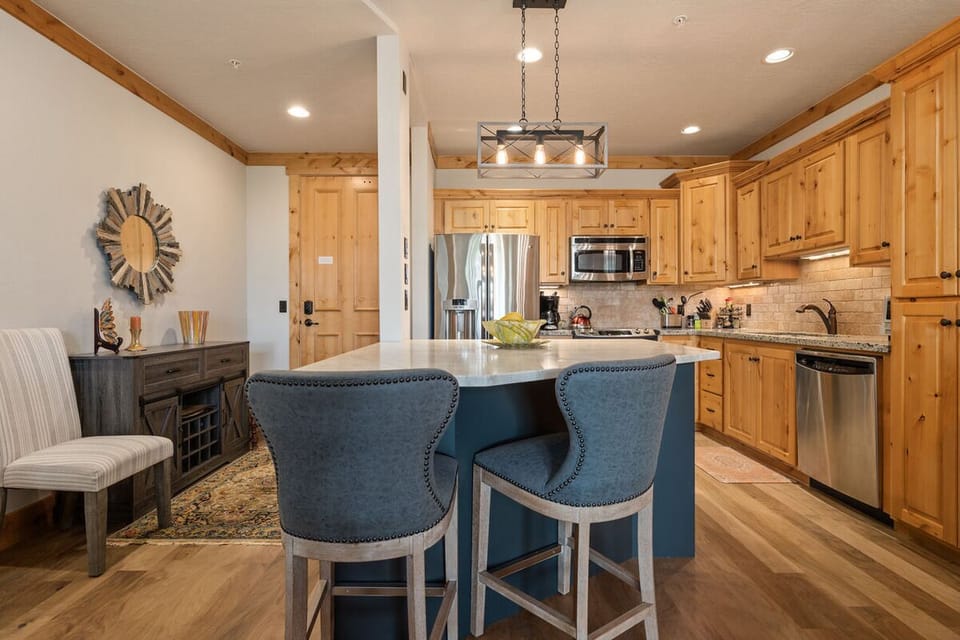 Cook comfortably in a spacious kitchen with warm wood tones.