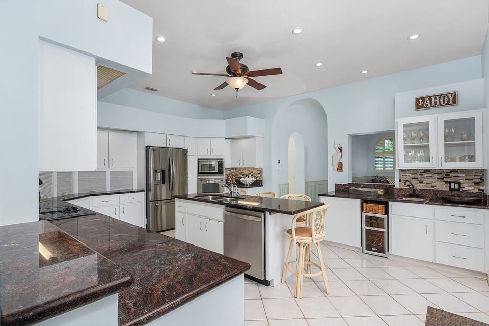  Large fully equipped kitchen w/wet bar is located in the center of main floor 
