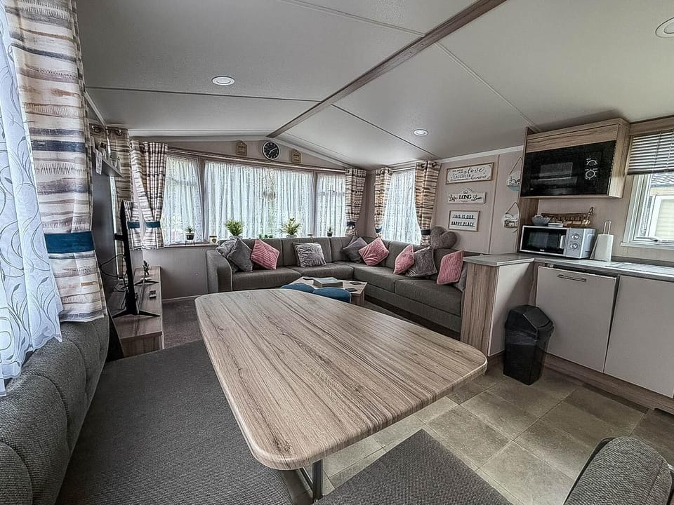 This communal space is the heart of your holiday retreat, allowing the whole family to be together whether you're cooking a meal, enjoying dinner, or relaxing on the sofa after a day of Essex adventure.