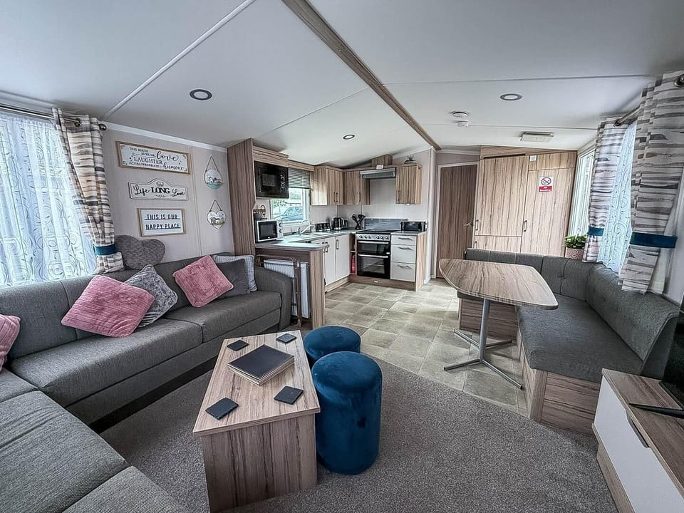 With comfortable seating and a dedicated dining space, this central hub is perfectly appointed for everything from relaxed family breakfasts to cosy evenings in after a day of exploring Clacton-On-Sea, Essex.
