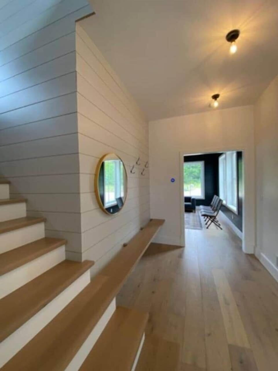 large hall way from kitchen to secondary hang out space on 1st floor and the  2 bedrooms.
