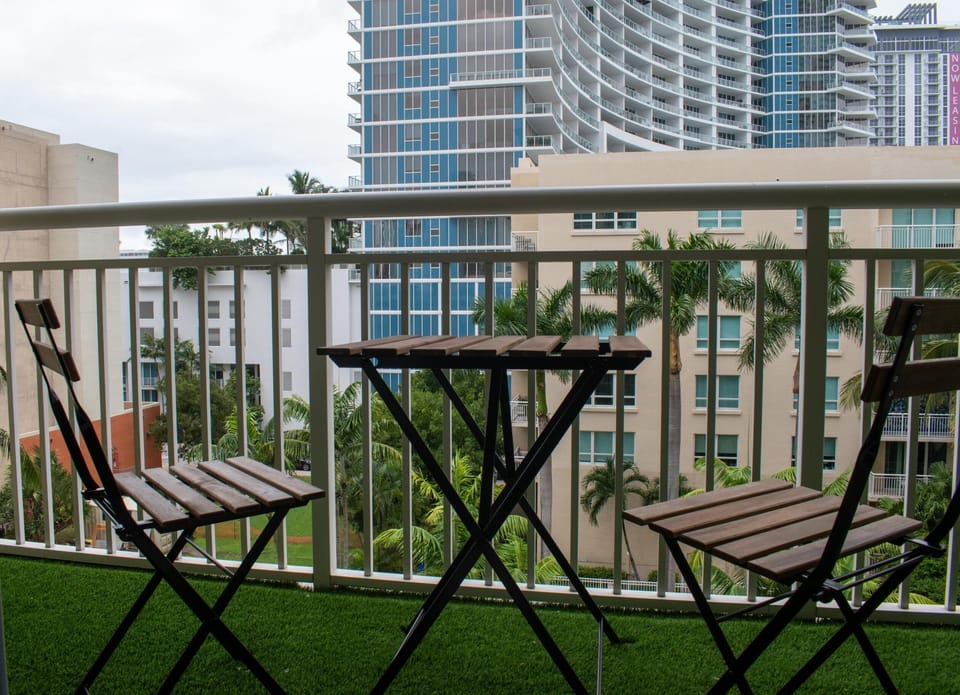 Enjoy city and pool views from the balcony that sits off the living room