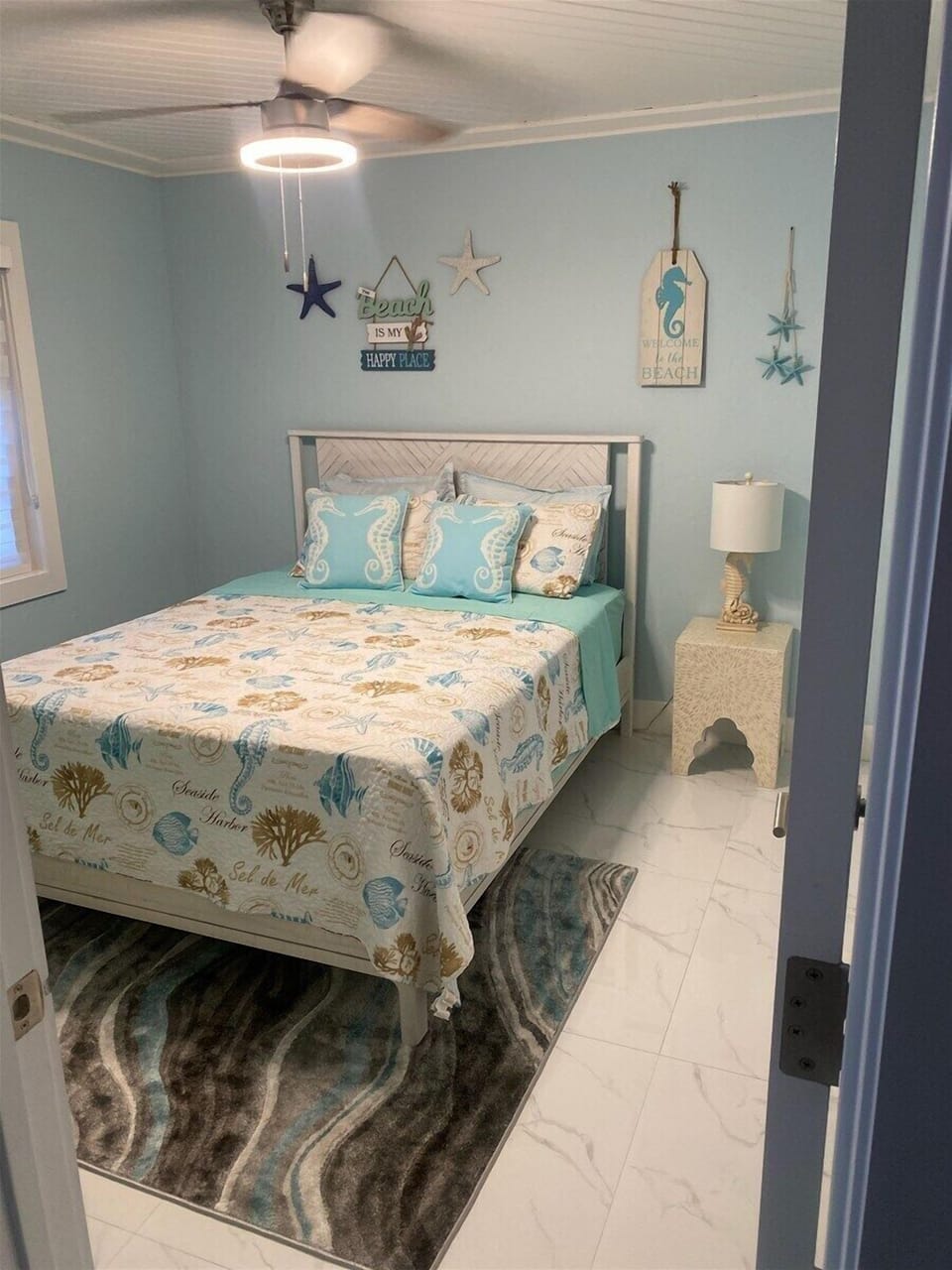 A charming bedroom offering comfort, privacy, and island-inspired décor.