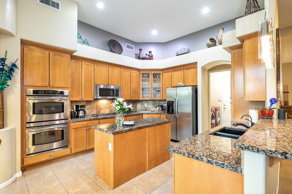 Huge kitchen with granite counters.