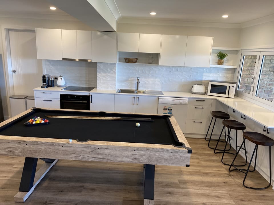 Downstairs kitchen with Combo table (dining, table tennis, pool)