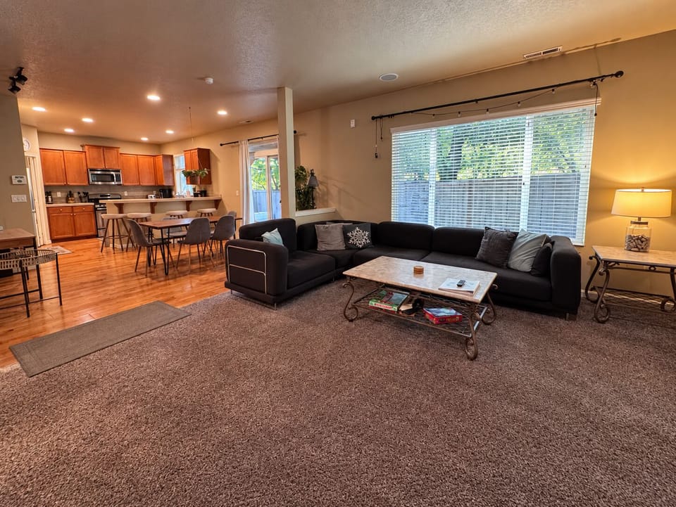 Open-concept layout connecting the living room, dining area, and kitchen.