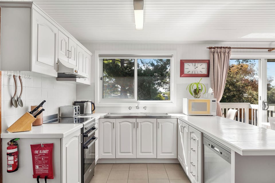 Fully equipped kitchen with bright natural light