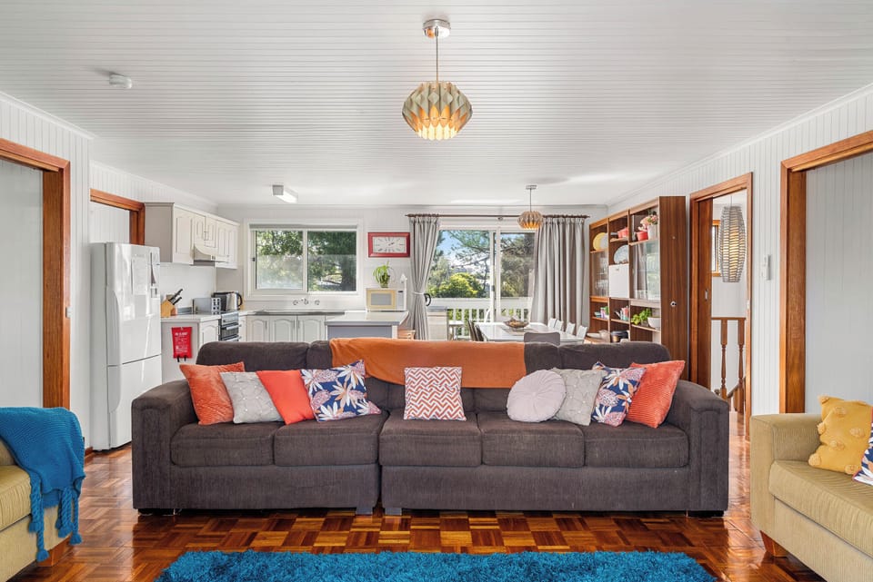 Inviting living space with open plan kitchen and cozy seating
