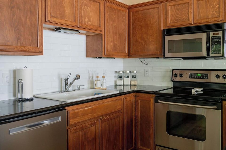 Well stocked with everything to cook, bake and store + basics, oil and spices.