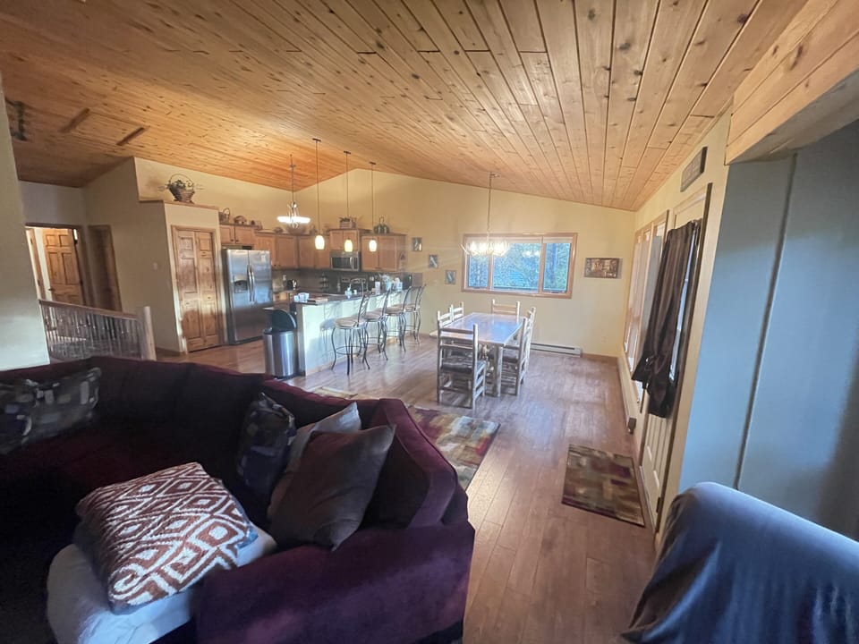 Open concept living and dining room for great entertaining! New wood-like floors