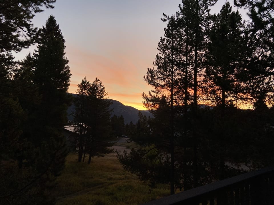Beautiful sunrise and view of the mountains from the wrap around porch 