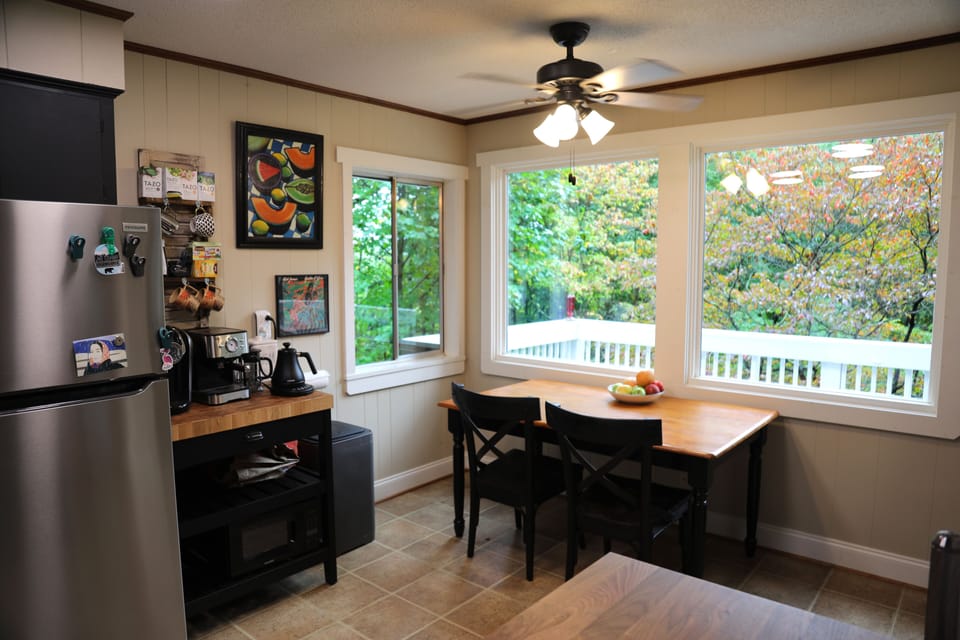 Kitchen area with breakfast table overlooking the back deck.