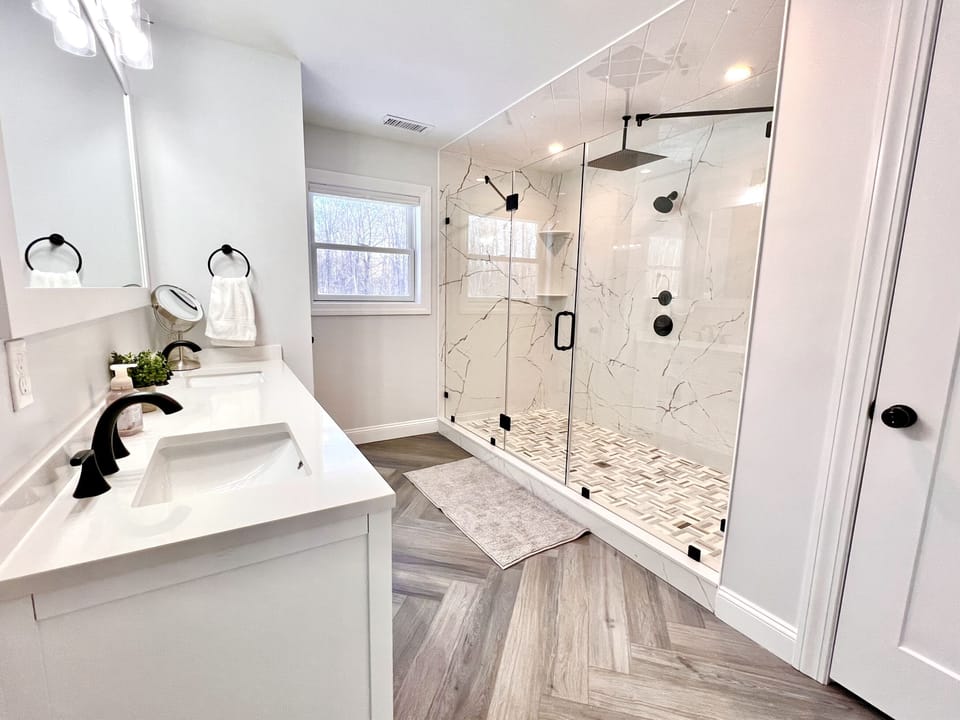 Primary Bath: dual vanity, shower with 3 heads, closet, separate toilet