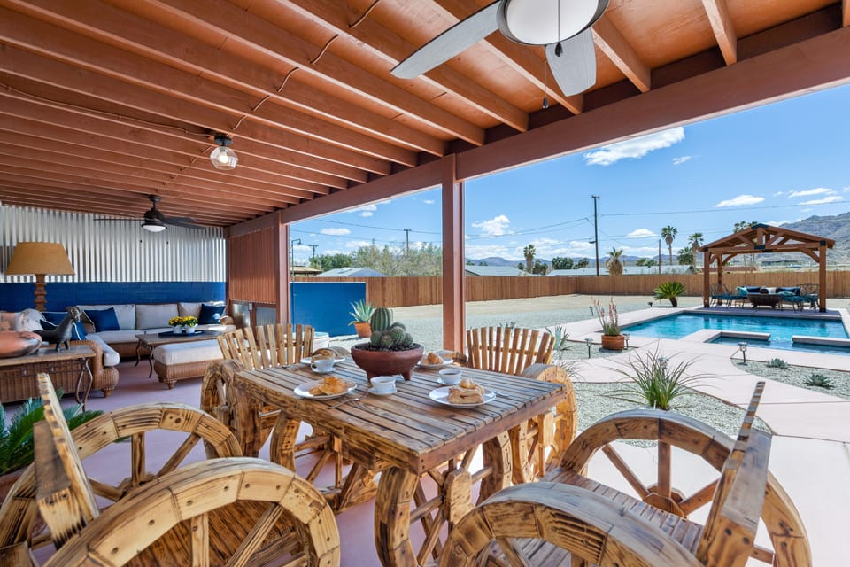 Backyard covered porch breakfast table. 
