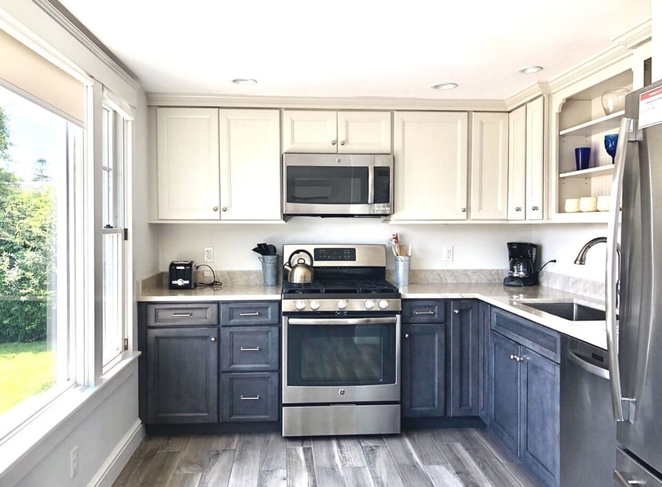 Full kitchen with stainless steel appliances and granite countertop
