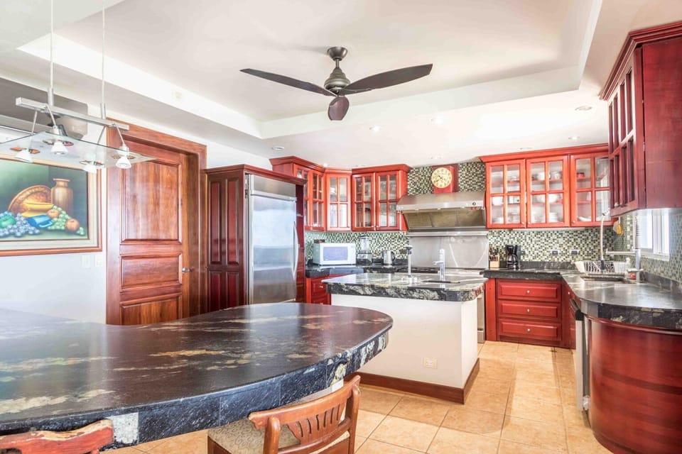 Kitchen area with access to outside BBQ.  Spacious and well equipped!