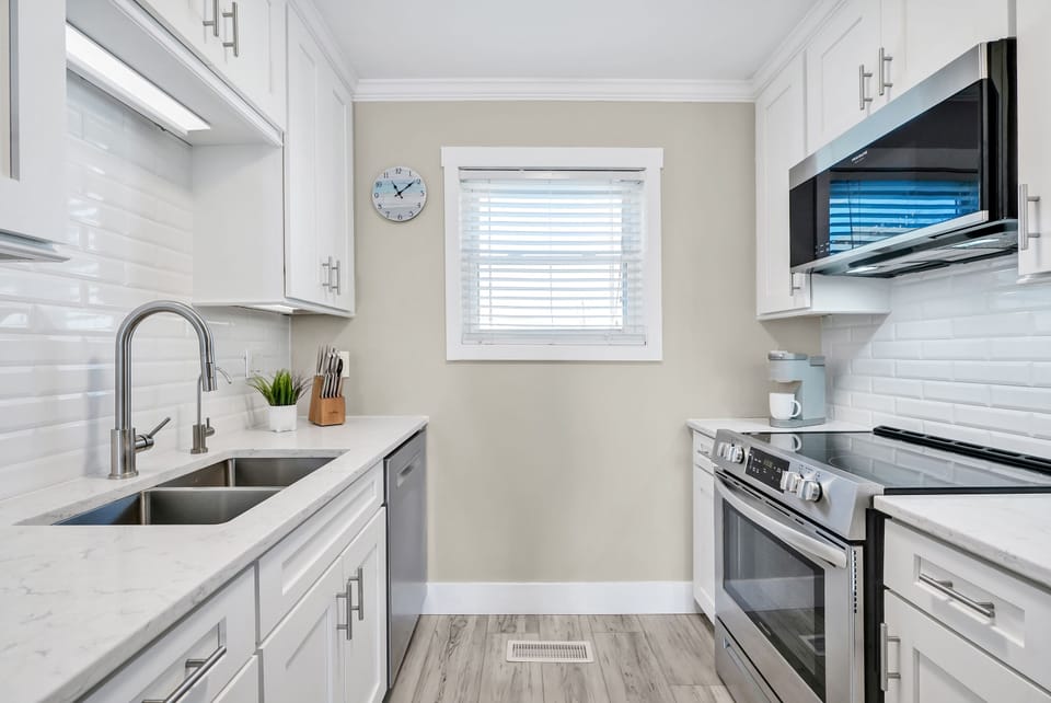 A fully renovated kitchen with new appliances.