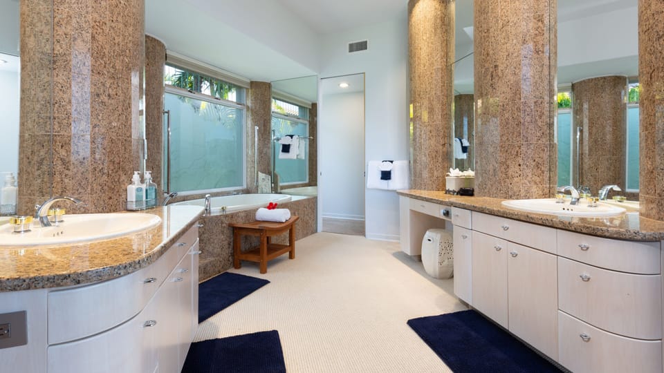 Primary Ensuite #1 with soaking tub and his and hers vanities